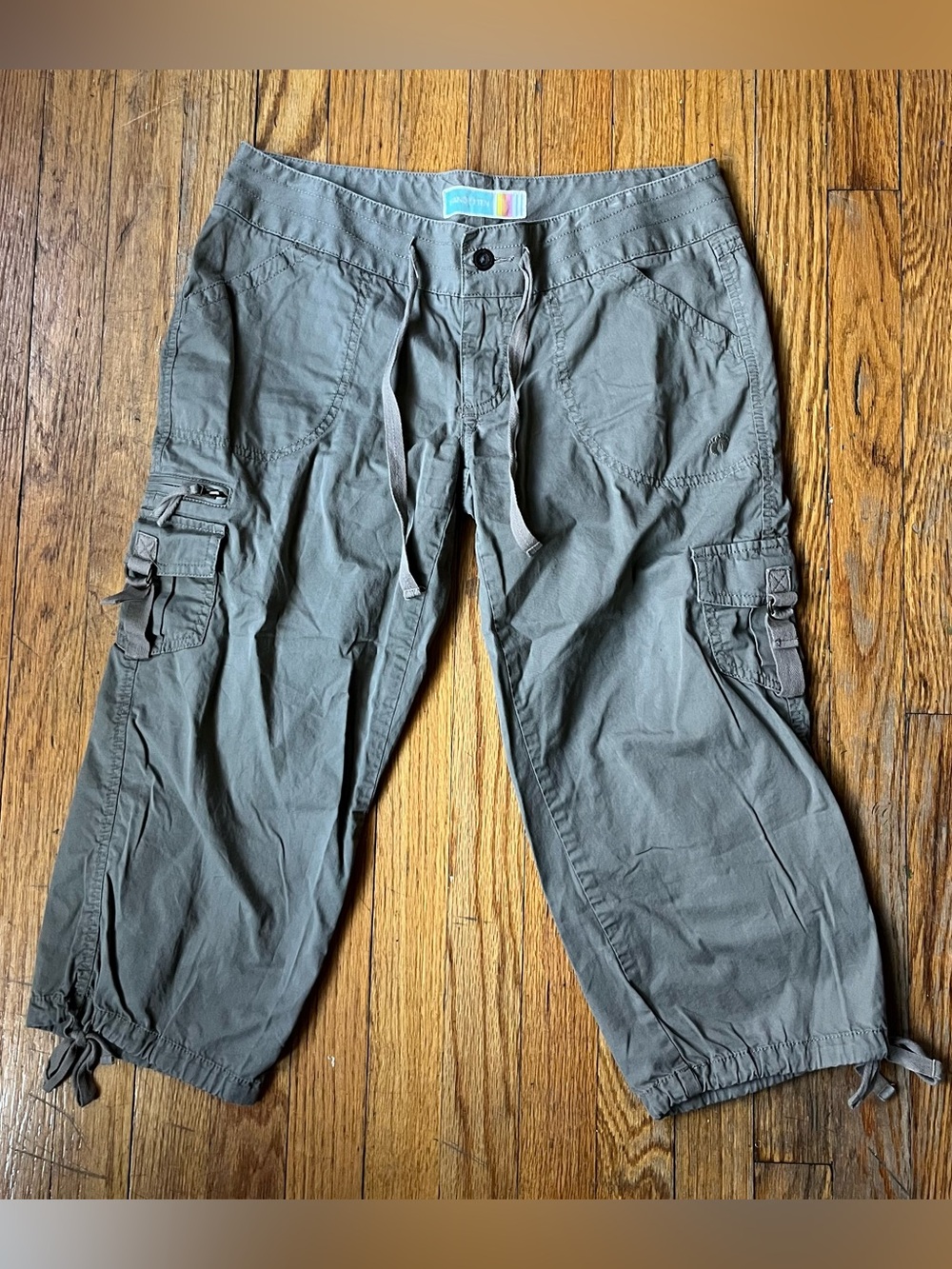 Earthy green cargo capri pants with adjustable drawstring waist